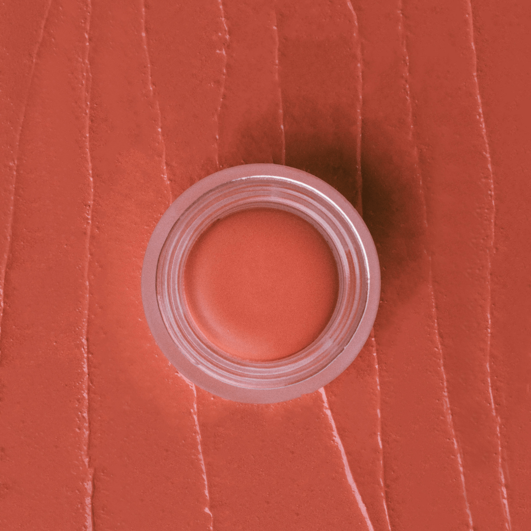 Eco By Sonya Cream Blush in pink coral universal shade, showing rich creamy texture and natural colour smear.